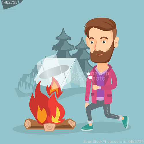 Image of Businessman roasting marshmallow over campfire.