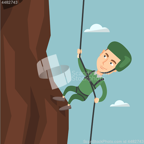 Image of Man climbing a mountain with a rope.