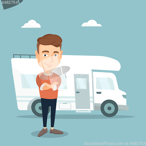 Image of Man standing in front of motor home.