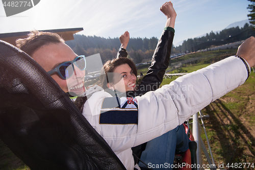 Image of couple enjoys driving on alpine coaster