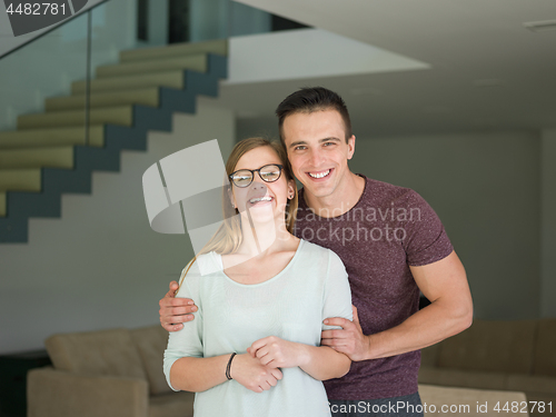 Image of couple hugging in their new home