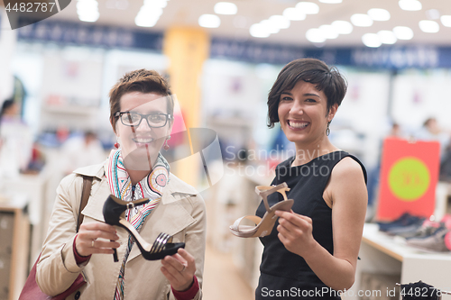 Image of best friend shopping in big mall