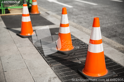 Image of close up of traffic or road cones on city street