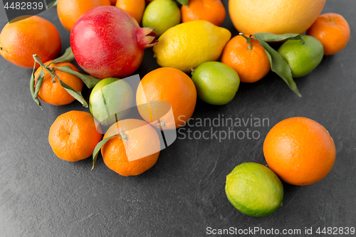 Image of close up of citrus fruits on stone table