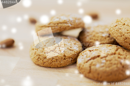 Image of close up of oatmeal cookies over snow