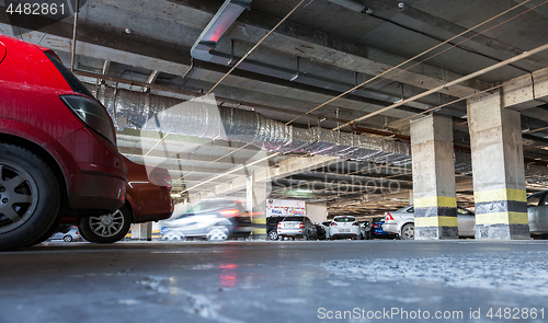 Image of Different cars parked at the parking lot Aurora shopping mall