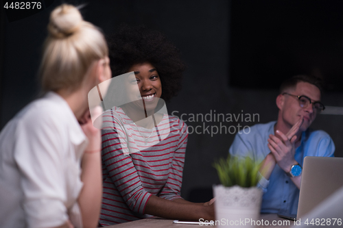 Image of Multiethnic startup business team in night office