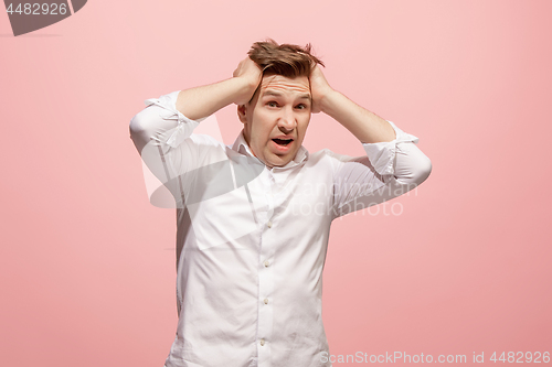 Image of Handsome man in stress isolated on pink