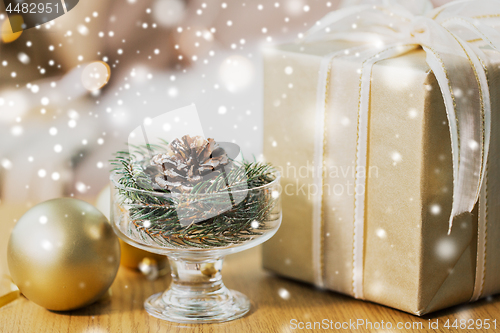 Image of christmas fir decoration with cone, ball and gift