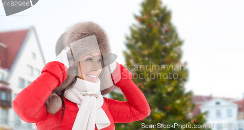 Image of happy woman over christmas tree in tallinn