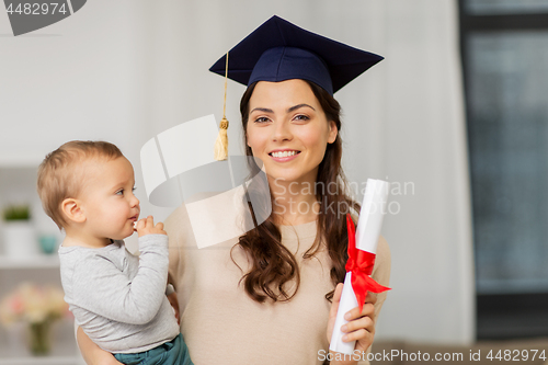 Image of mother student with baby boy and diploma at home