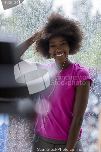 Image of portrait of young afro american woman in gym