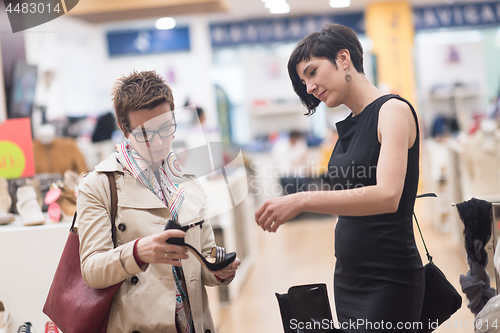 Image of best friend shopping in big mall