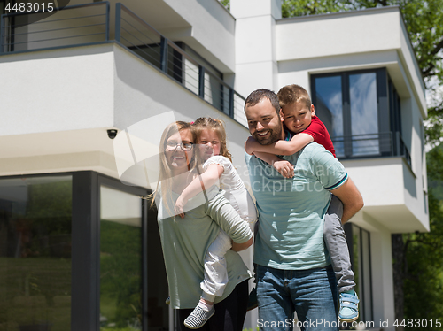 Image of happy family with children in the yard