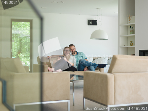 Image of couple relaxes in the living room