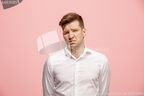 Image of Beautiful bored man isolated on pink background