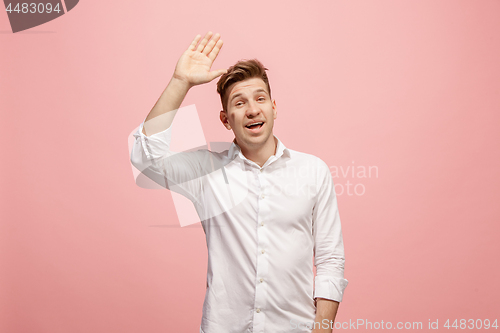 Image of Isolated on pink young casual man shouting at studio