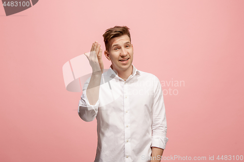 Image of Isolated on pink young casual man shouting at studio