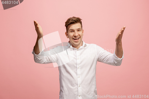 Image of Isolated on pink young casual man shouting at studio