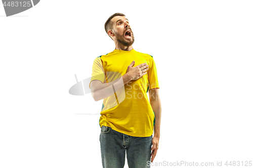 Image of Brazilian fan celebrating on white background