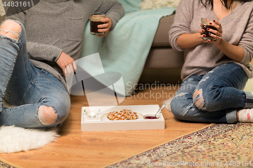 Image of close up of couple drinking coffee at home