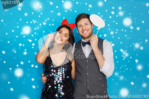 Image of happy couple with party props having fun