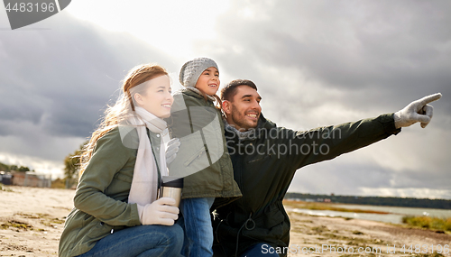 Image of happy family on autumn beach