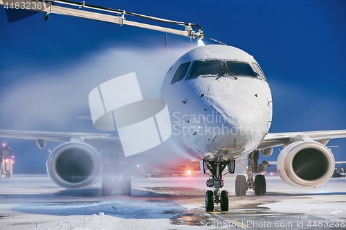 Image of Deicing of airplane