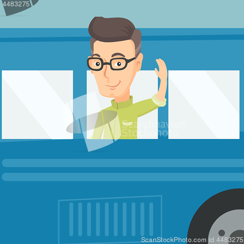 Image of Man waving hand from bus window.