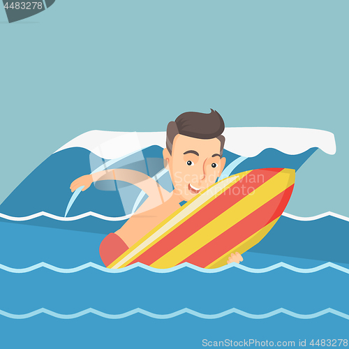 Image of Happy surfer in action on a surfboard.