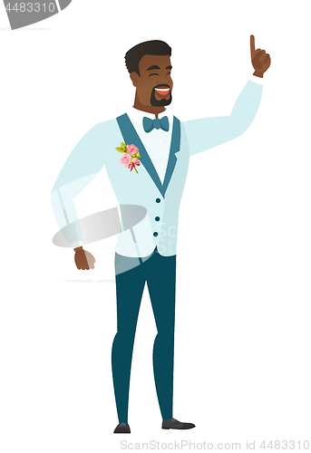 Image of African groom pointing with his forefinger.