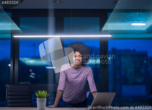 Image of black businesswoman using a laptop in startup office