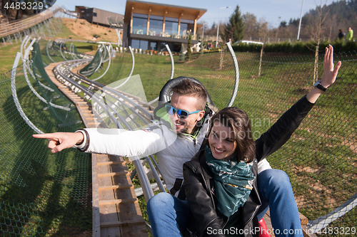 Image of couple enjoys driving on alpine coaster