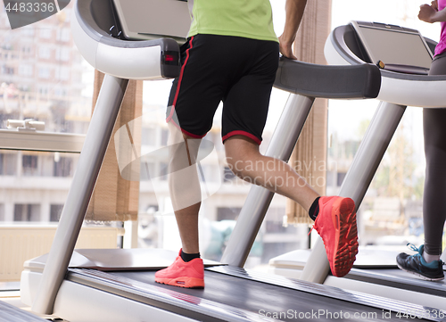 Image of people exercisinng a cardio on treadmill in gym