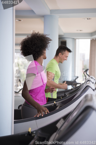 Image of people exercisinng a cardio on treadmill in gym