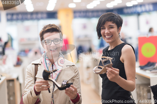 Image of best friend shopping in big mall