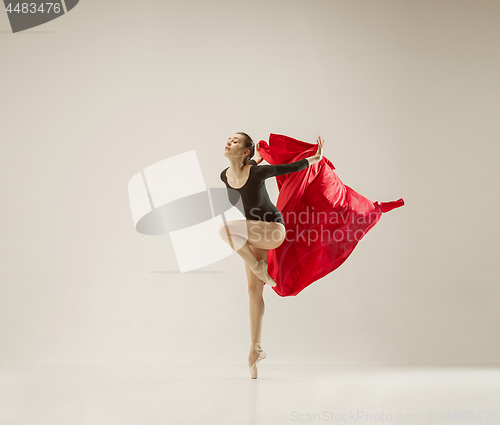 Image of Modern ballet dancer dancing in full body on white studio background.