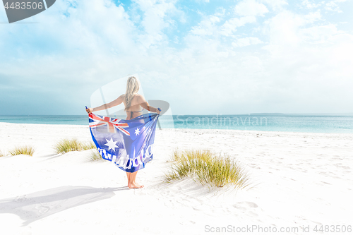 Image of Suntanned woman on beautiful beach in Australia