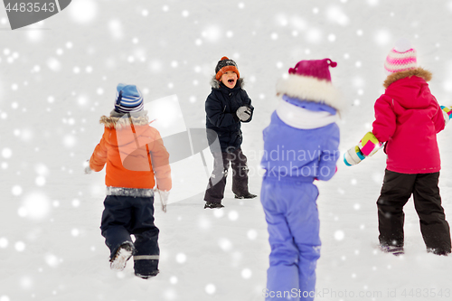 Image of happy little kids playing outdoors in winter