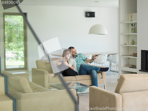 Image of couple relaxes in the living room