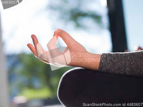 Image of young woman doing morning yoga exercises