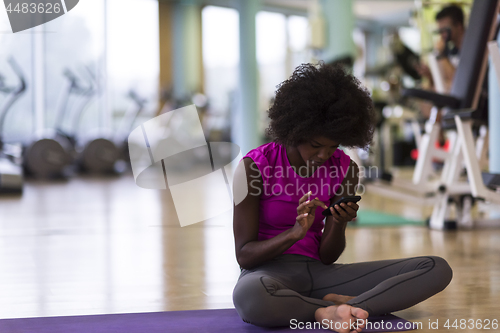 Image of african american woman exercise yoga in gym