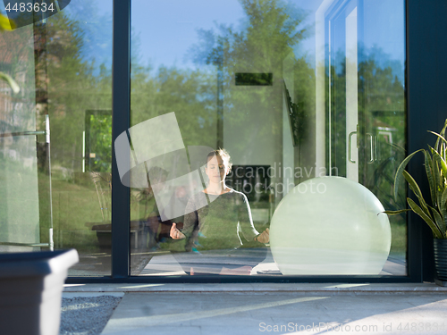 Image of young woman doing morning yoga exercises