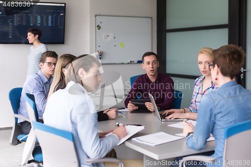 Image of Business Team At A Meeting at modern office building