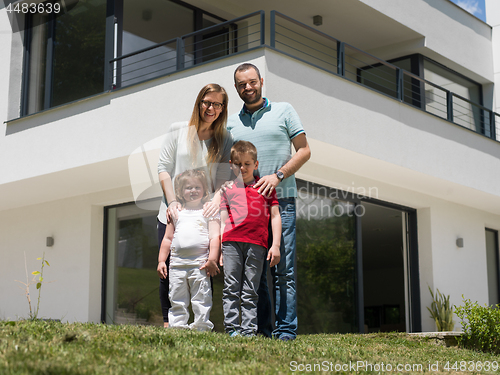 Image of happy family with children in the yard