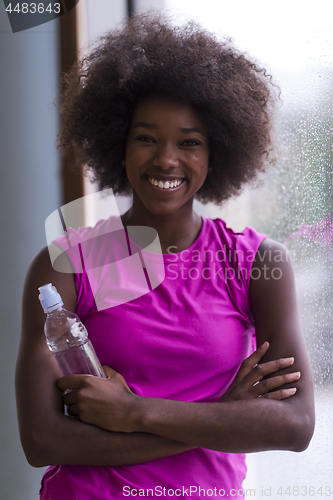 Image of portrait of young afro american woman in gym