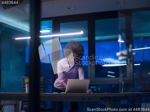 Image of black businesswoman using a laptop in startup office