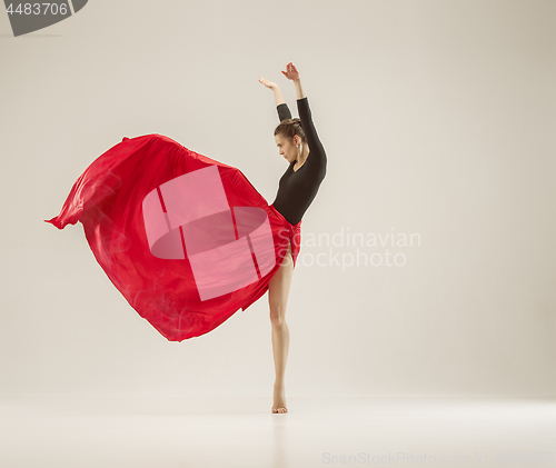 Image of Modern ballet dancer dancing in full body on white studio background.