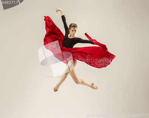 Image of Modern ballet dancer dancing in full body on white studio background.