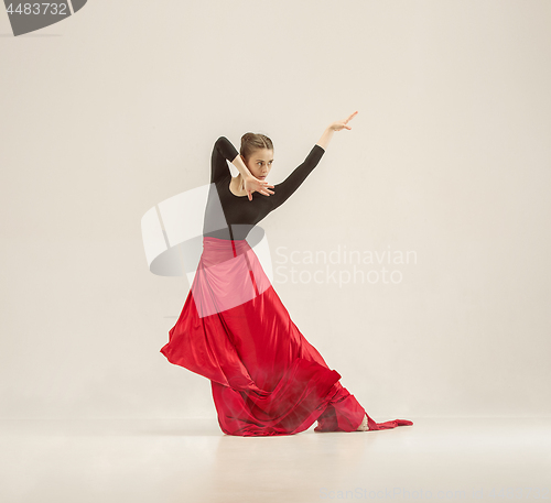 Image of Modern ballet dancer dancing in full body on white studio background.